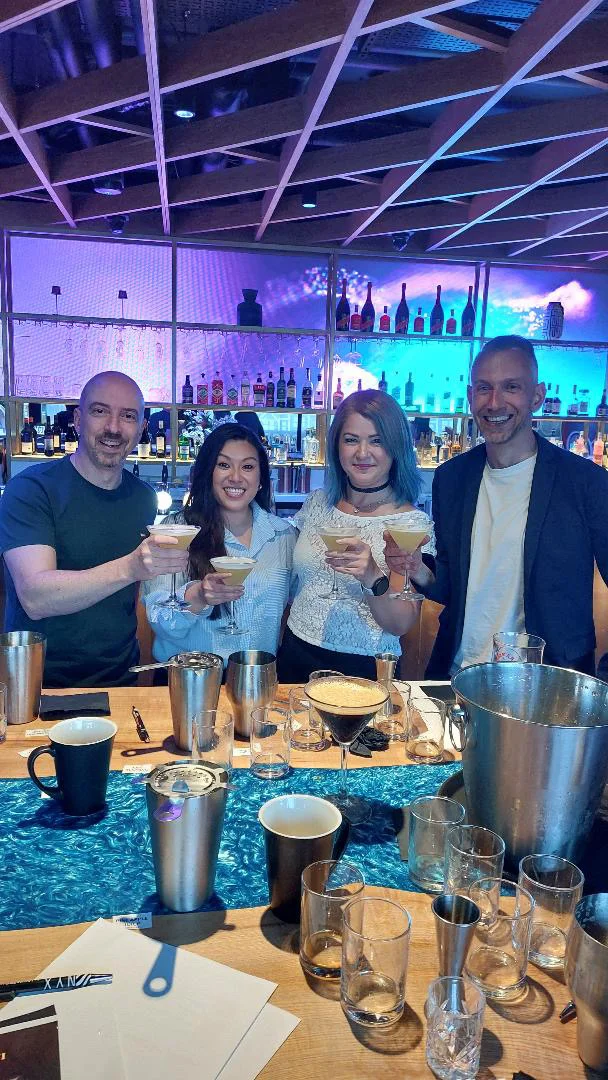 Guests holding cocktails after a cocktail masterclass