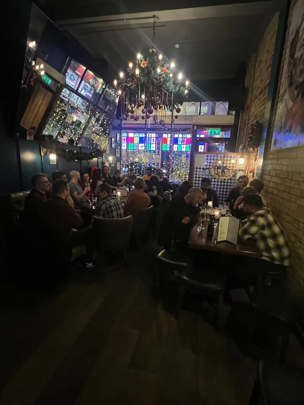 Guests gathered at a pub social event