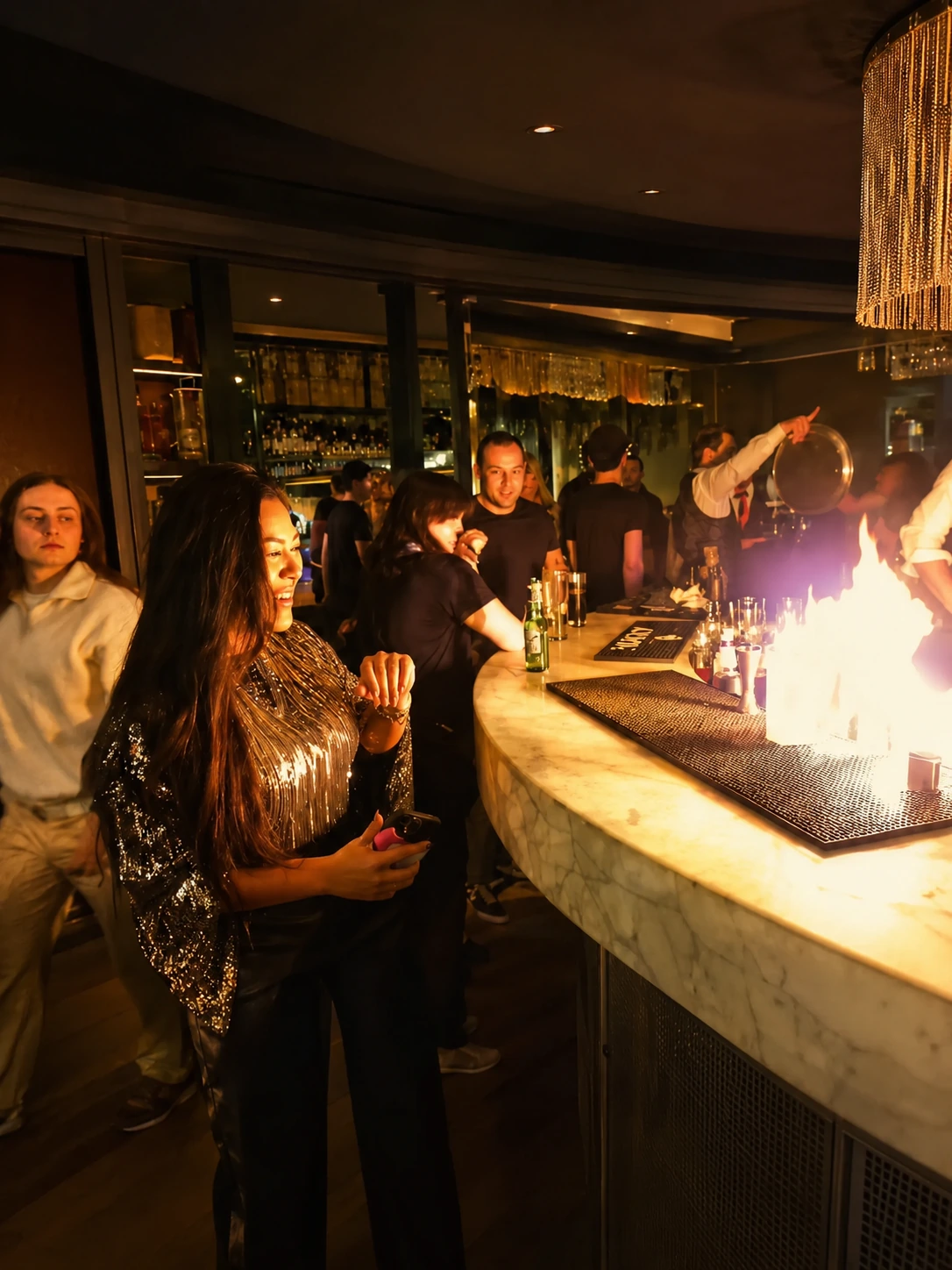 Guests enjoying a relaxed social event with a fire feature